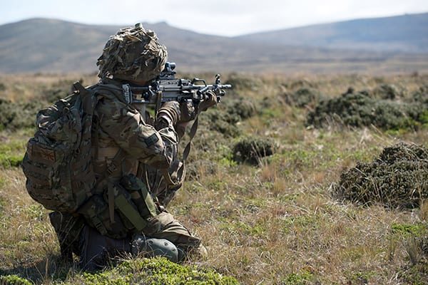 A soldier of First Fusiliers operating a LMG during a section level attack. 