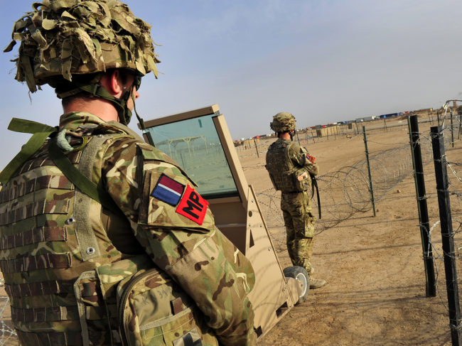 RAF Police guard the main entry point of Camp Bastion during Op Herrick, Afghanistan.