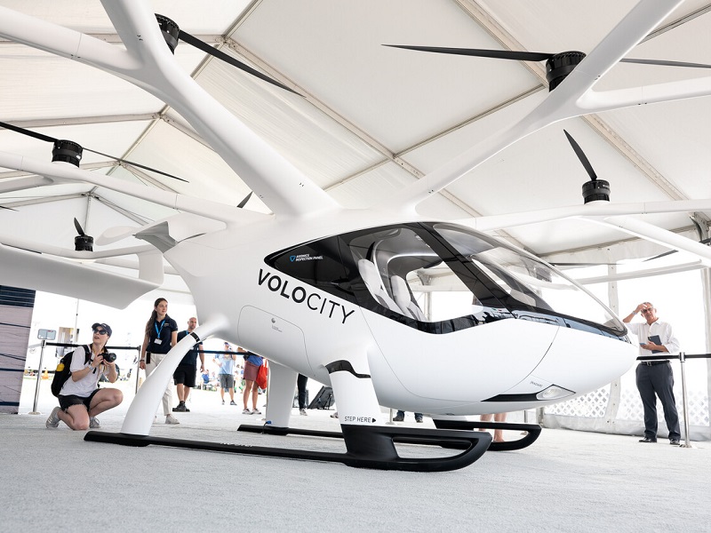 Volocopter at oshkosh eaa 21 booth volocity visitor taking pictures