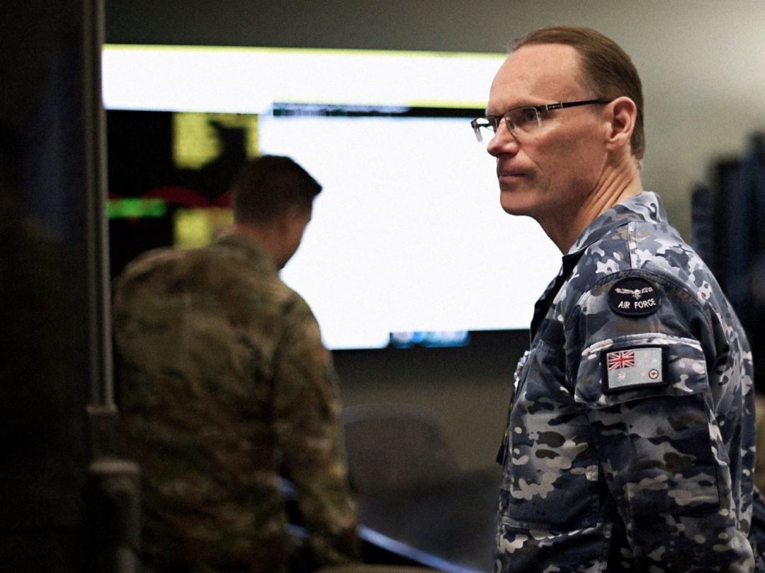 Royal Australian Air Force Group Capt Darrell May, Director of Space Forces, reviews the orbital warfare mission plan at the 392d Combat Training Squadron Battle Lab 